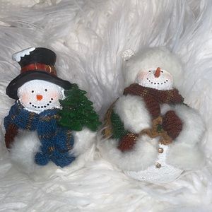 Two Snowman with furry clothing. (Jackets & hat)